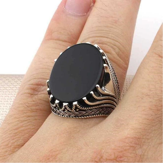 A Ring With Onyx As a Center Stone